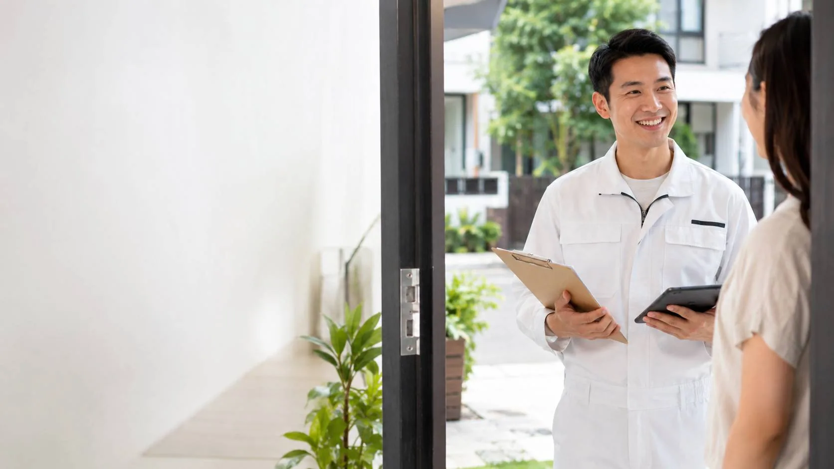 Friendly City Painters estimator greeting a homeowner at a Singapore home