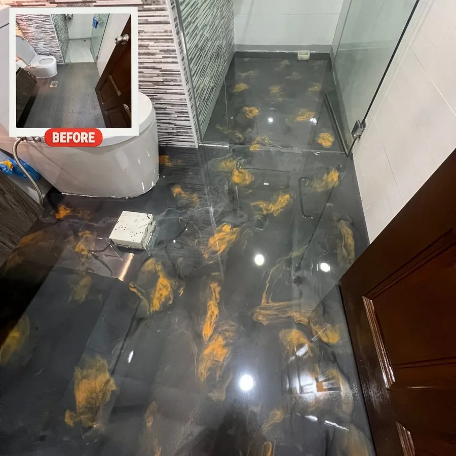 Black and copper metallic epoxy floor with swirl effect installed in a Singapore bathroom