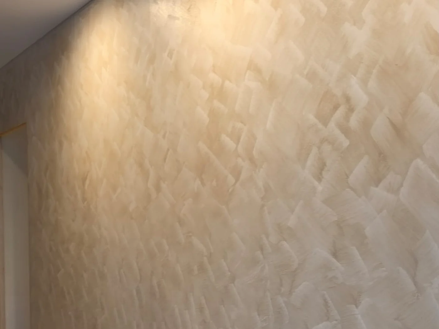 Soft limewash wall texture in warm neutral tone